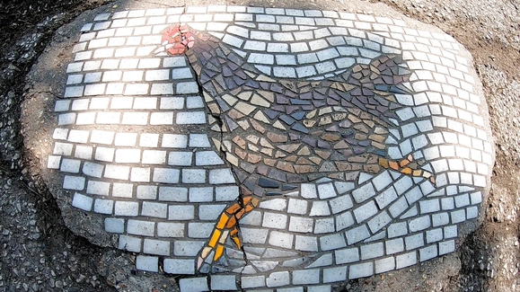 WATCH: The Chicago Street Artist Turning Potholes Into Works of Art ...