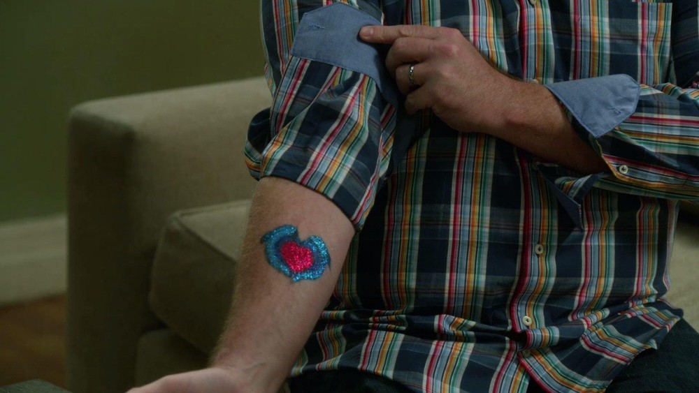 Cams Glitter Tattoo Of Two Dolphins Modern Family