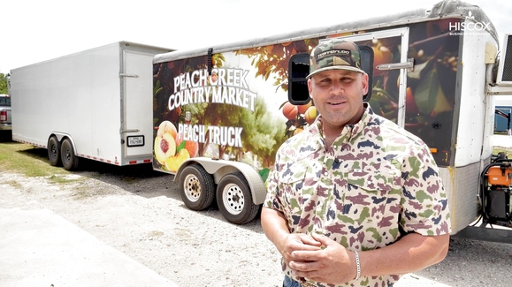 Off duty, this firefighter trades his uniform for fruit crates