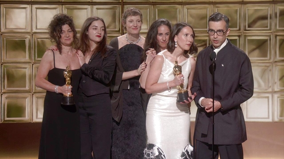 TWO PEOPLE EXCHANGING SALIVA Accepts the Oscar for Live Action Short Film